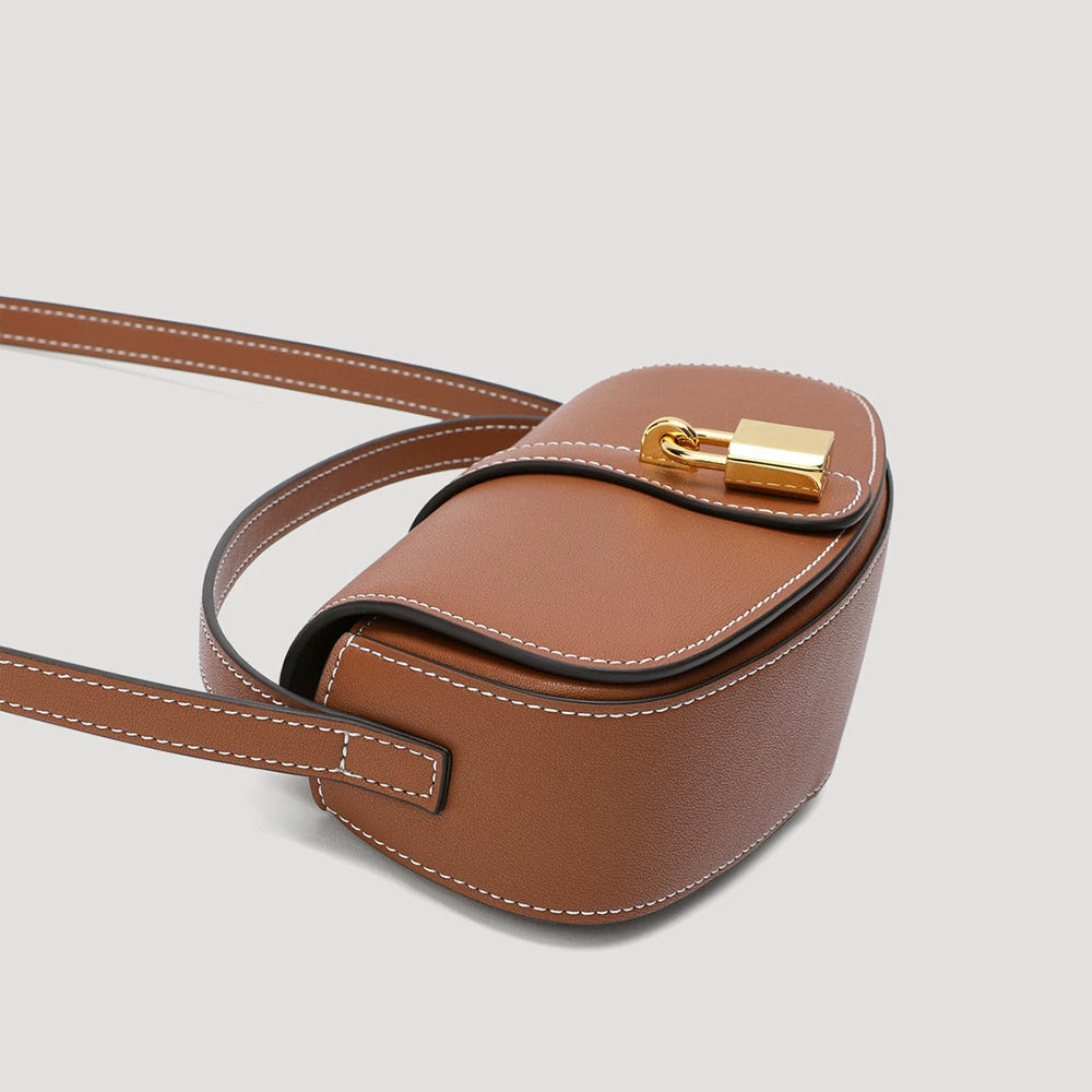 Tan Leather Saddle Bag with Gold Lock | Contrast Stitch Shoulder & Crossbody Handbag for Women